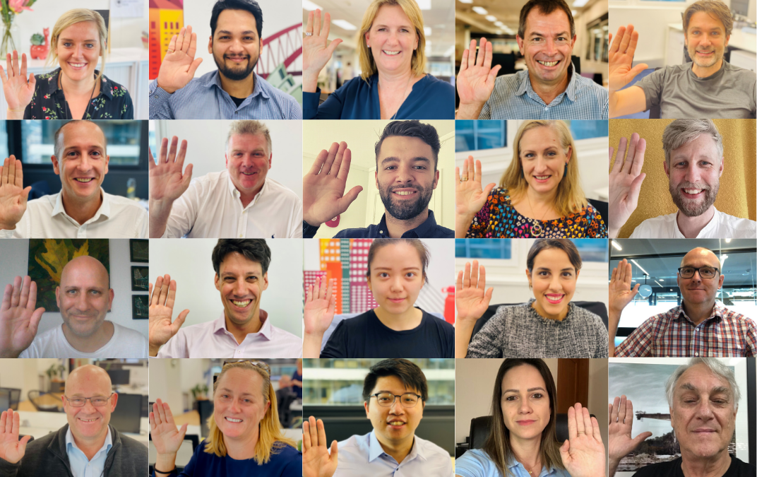 team members raising hands in solidarity to i choose to challenge as the theme for 2021 international womens day