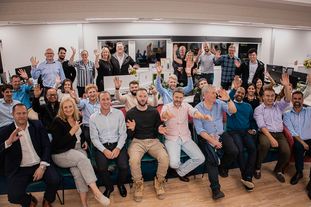 case civil and structural engineering corporate team group picture of engineers sitting in the office