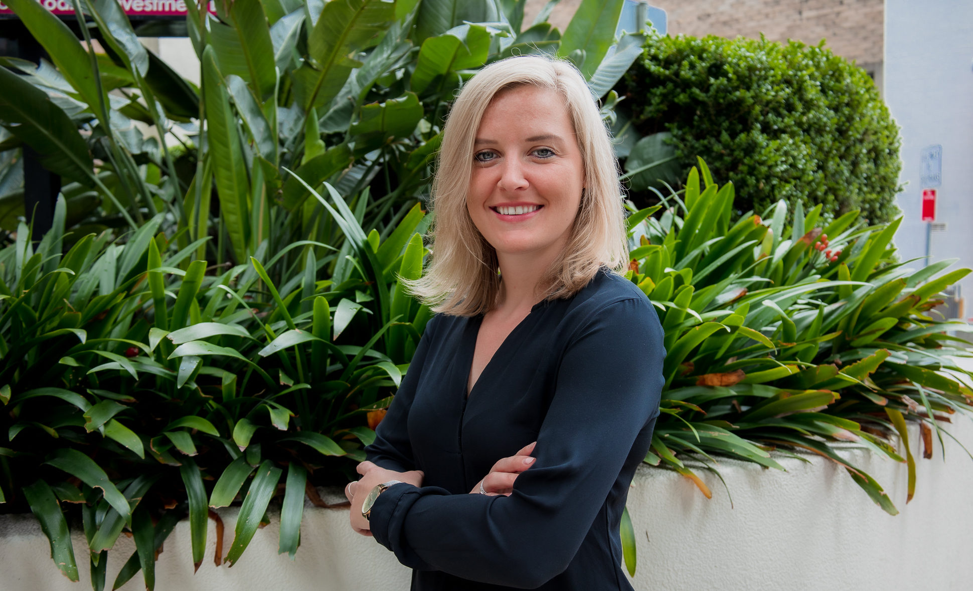 a corporate headshot portrait of group marketing manager lies desaer at the garden