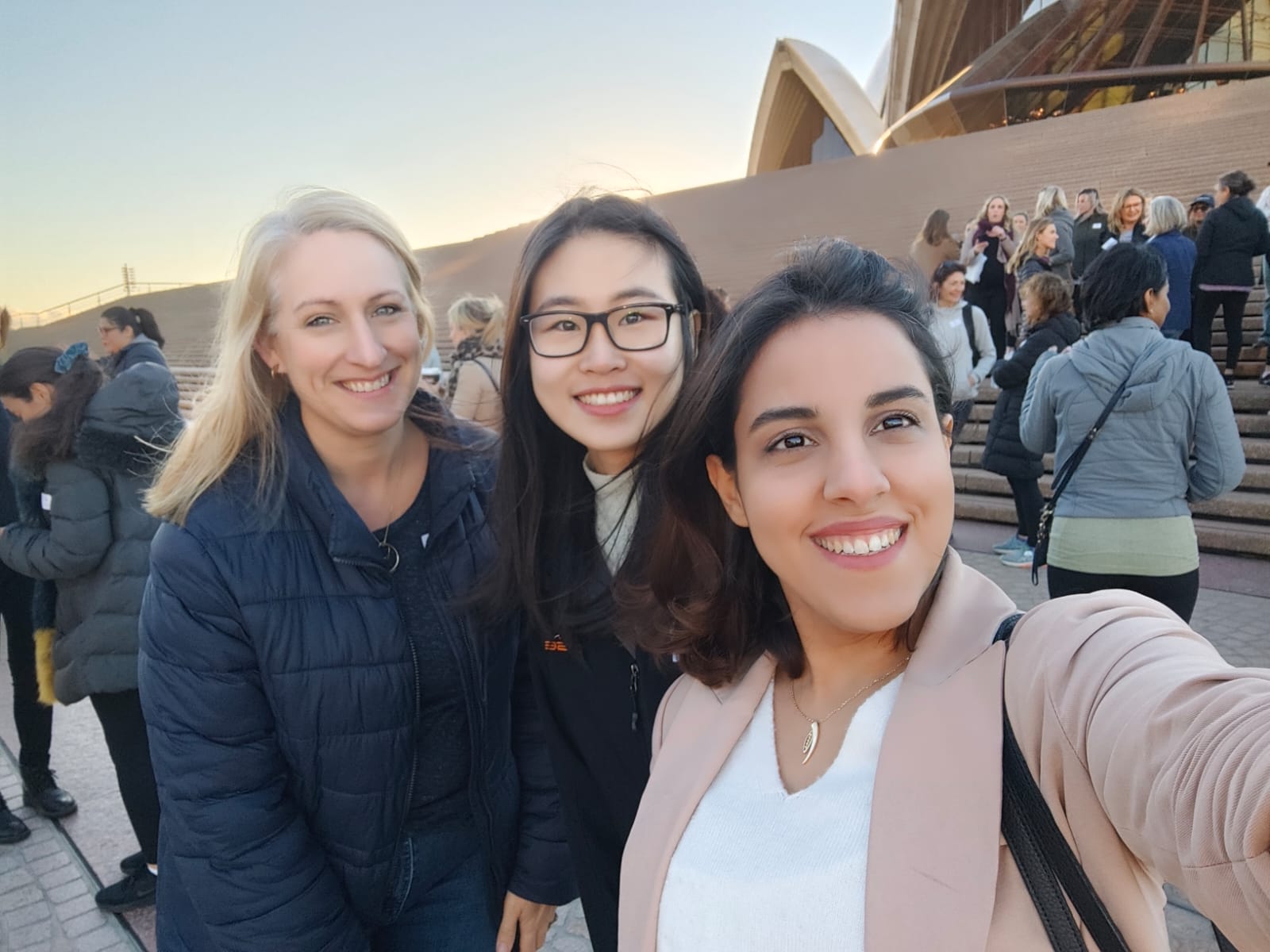civil engineer colleagues sarah stante jessie lie elnaz ebrahimi and team members in front of sydney opera house